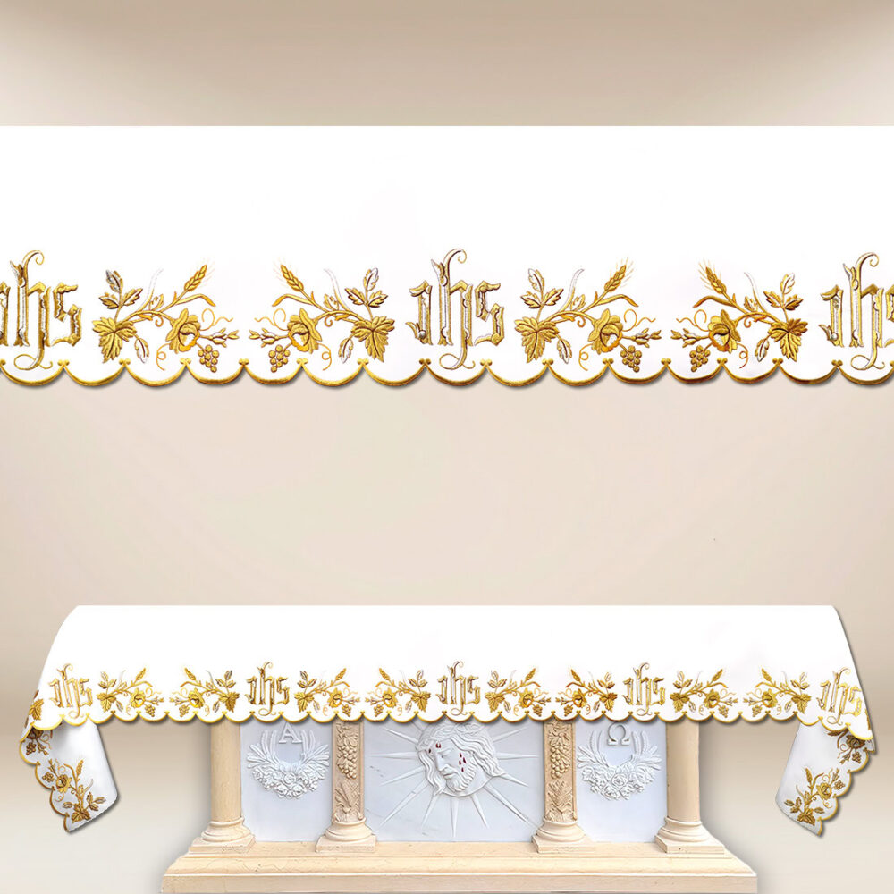 Tovaglia ricamata con un bellissimo ricamo dorato IHS